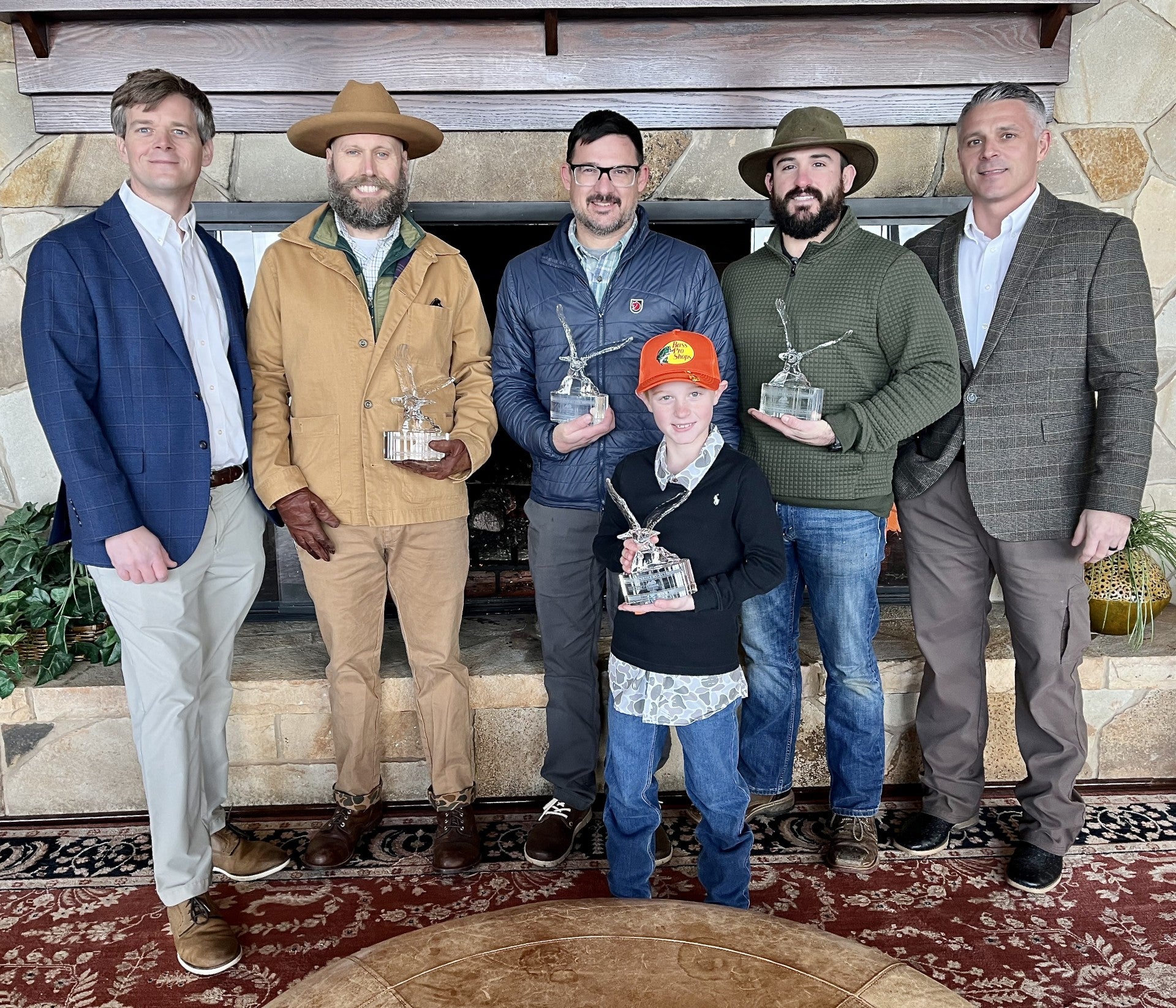 Alabama State Parks Director Matthew Capps (far left) and Deputy Director Chad Davis (far right) congratulate Eagle Award winners at Lake Guntersville State Park on Saturday, Jan. 31, 2025. The winners pictured from left between Capps and Davis, are Chris Stanley, Jonathan Farr, Cody Farr and Finley Rittenberry (in front). Other award winners were unable to attend. 