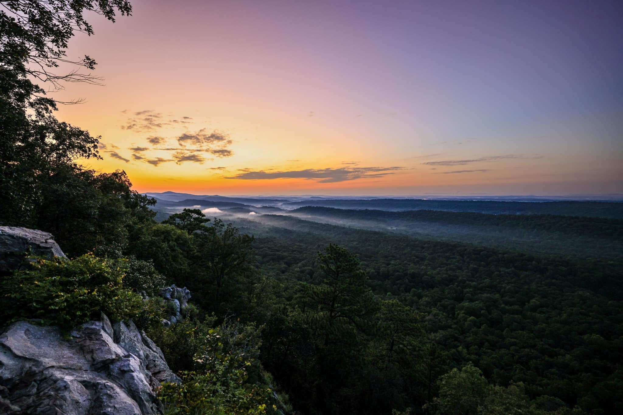 The sun sets over Oak Mountain State Park in Pelham, showcasing an amazing long-range view. 